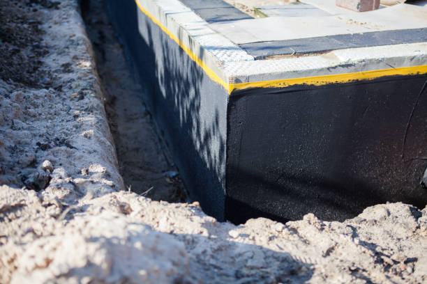 Professional Waterproofing technician working in Newport, SC